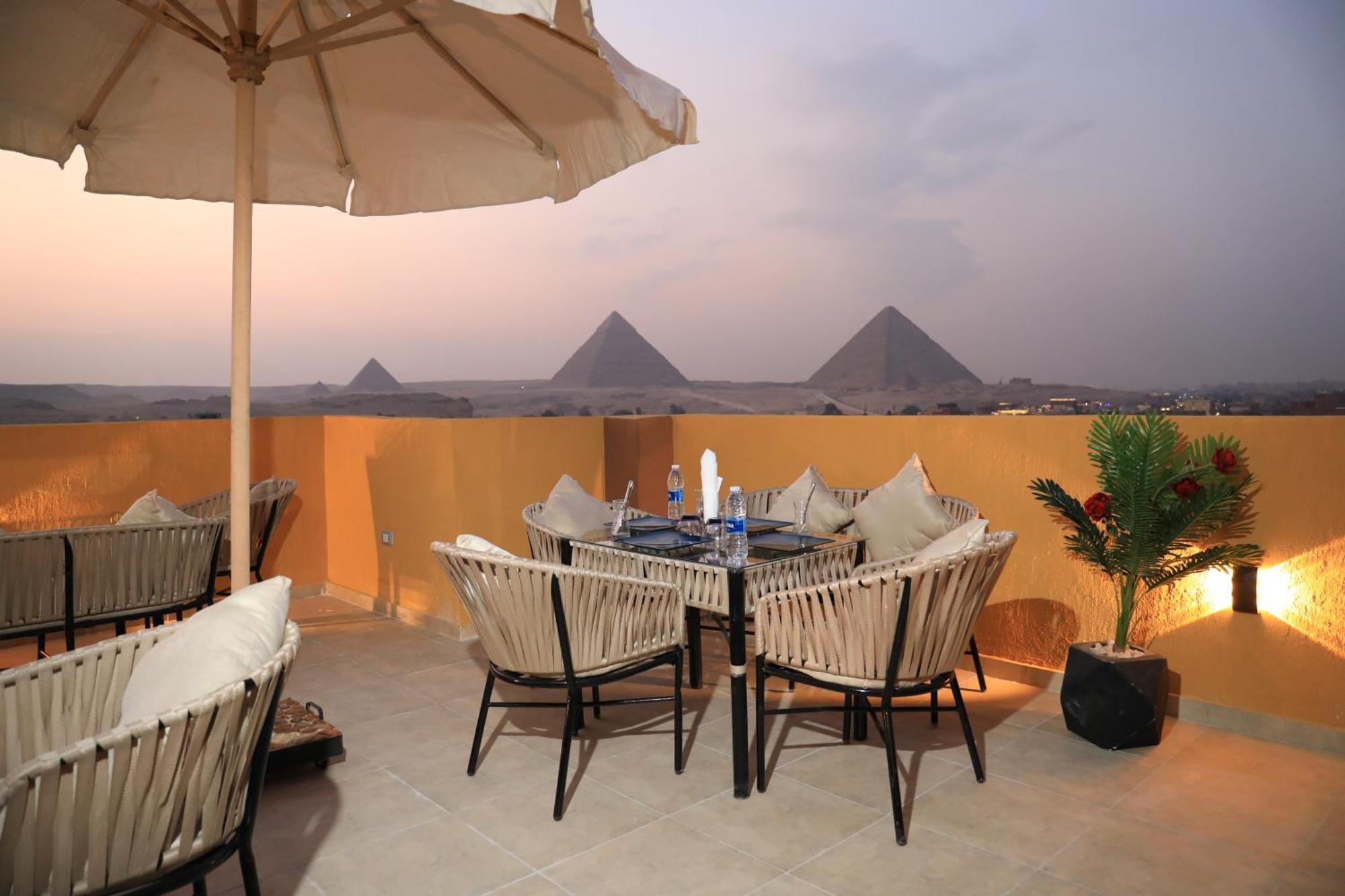 Pyramids Heart Hotel Kafrat al Jabal Bagian luar foto