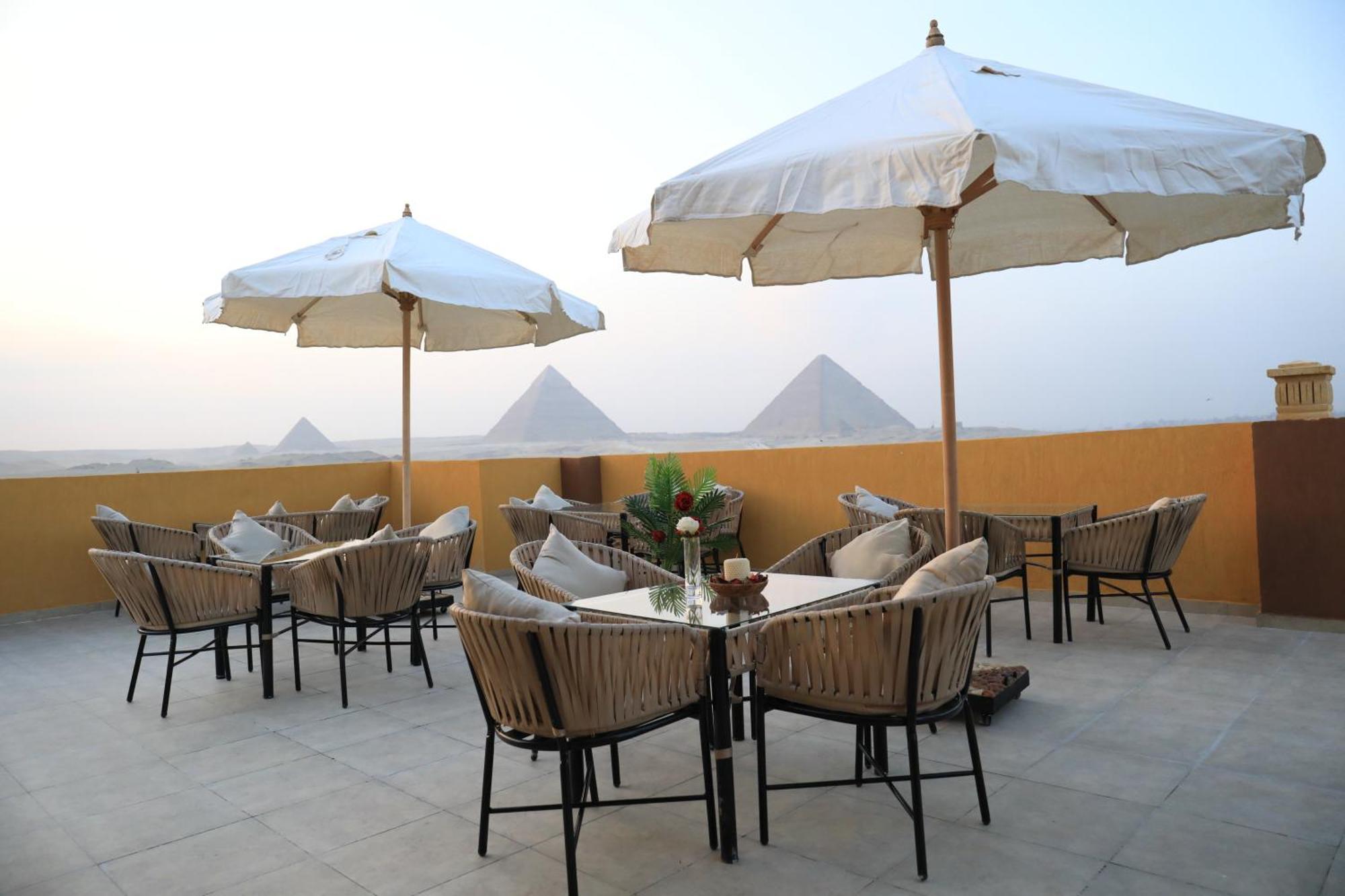 Pyramids Heart Hotel Kafrat al Jabal Bagian luar foto